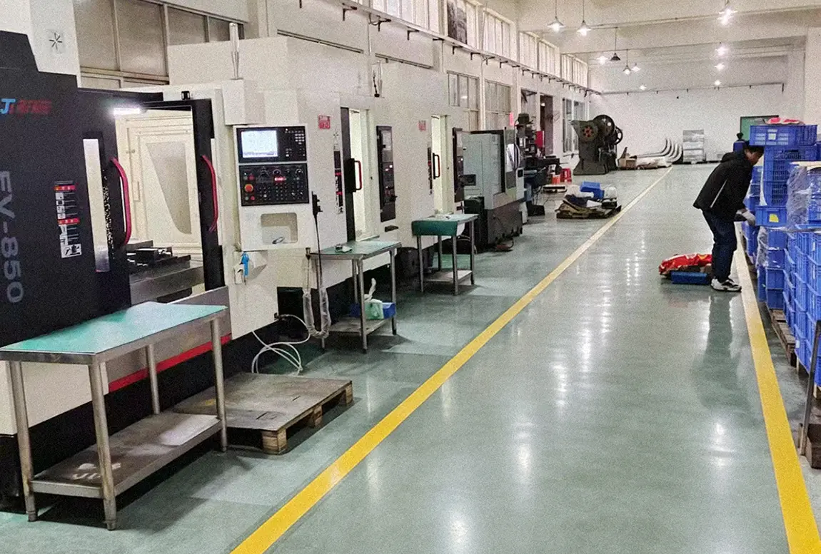 Row of CNC machining centers inside BW Sheet Metal production workshop
