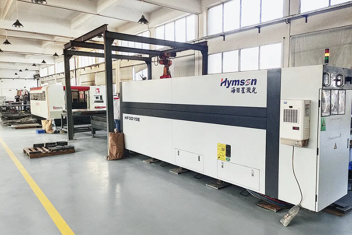 Large CNC fiber laser cutting equipment inside our sheet metal fabrication factory workshop