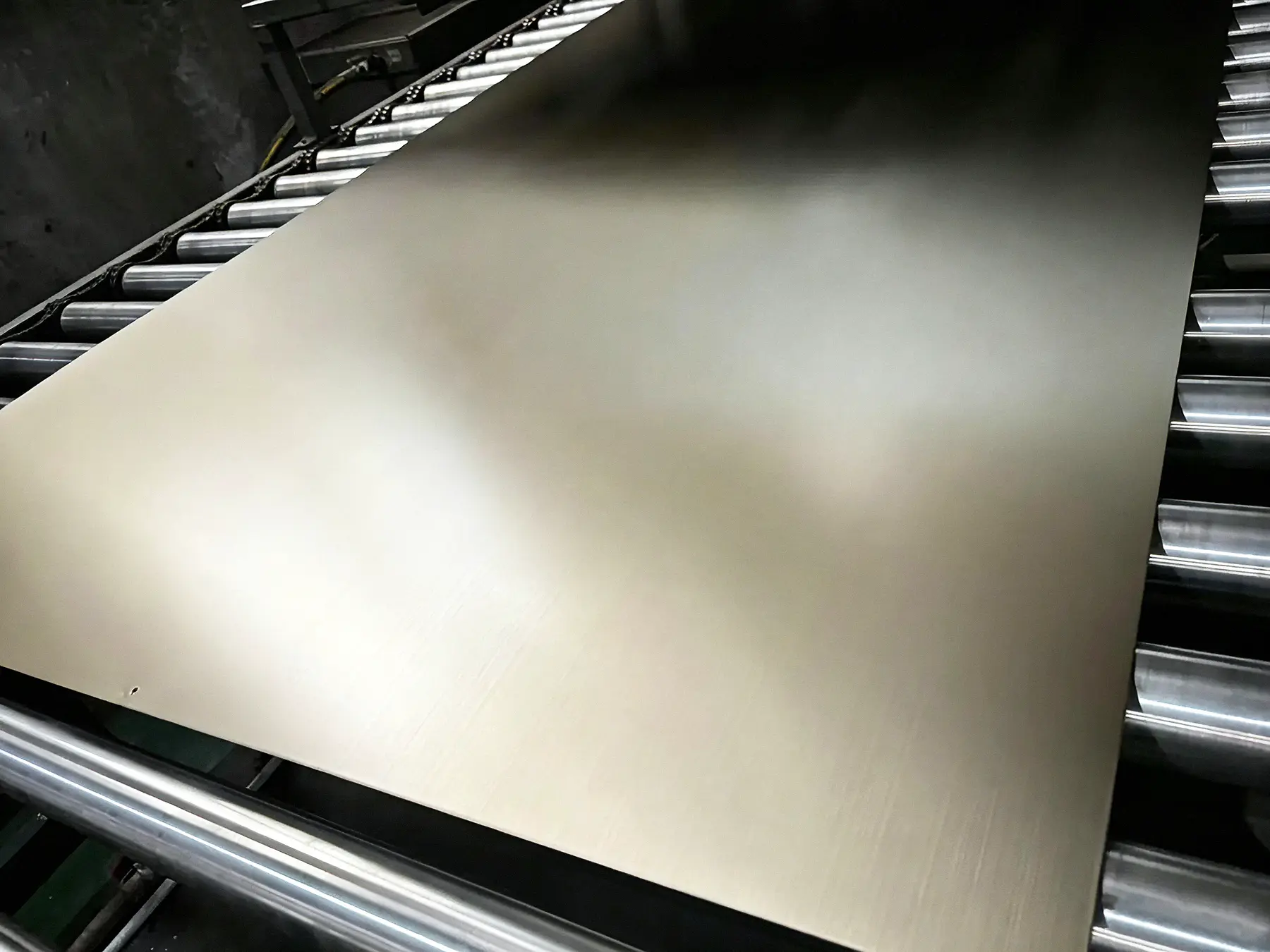 CNC drilling of a thick metal panel for architectural facade construction.