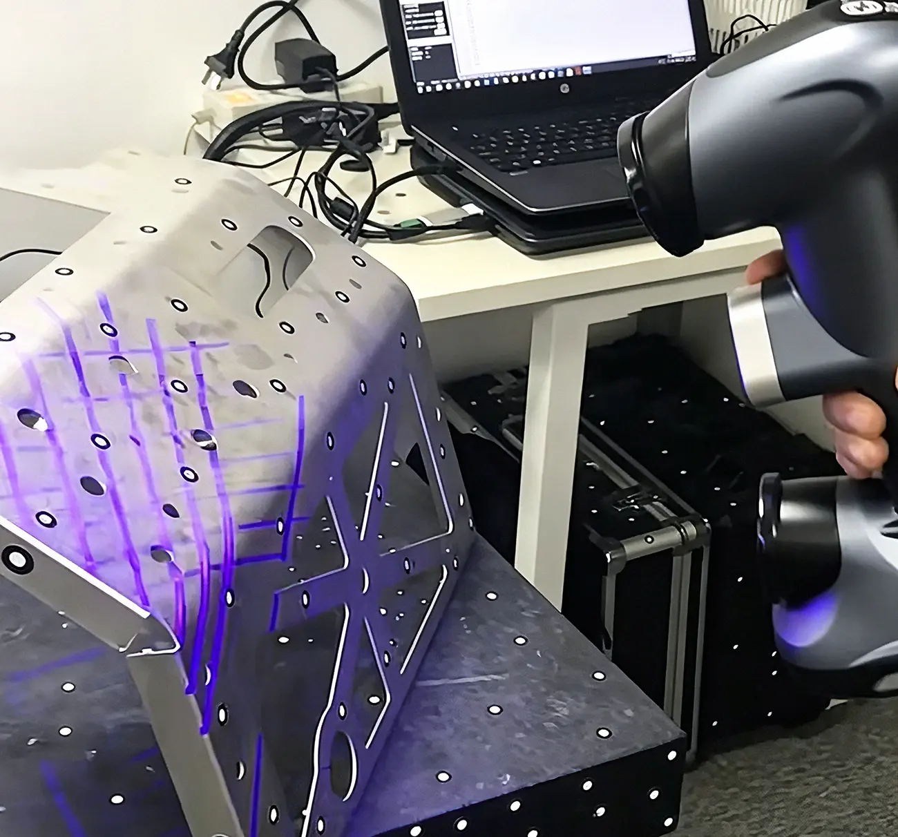 3D laser scanner performing a full dimensional inspection of a custom sheet metal enclosure under an ISO 9001 quality process