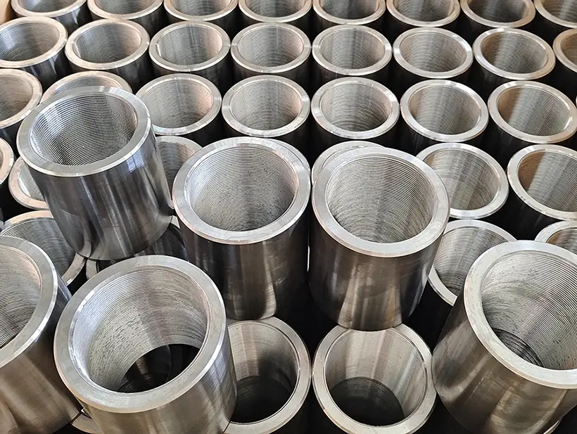 Production batch of CNC-turned stainless-steel threaded sleeves