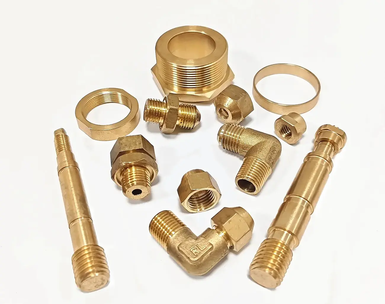 CNC-turned brass elbows, nuts, and shafts