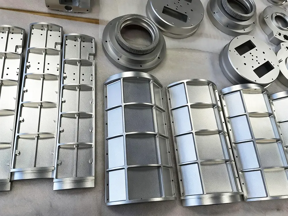 Production batch of CNC-milled curved aluminum housings