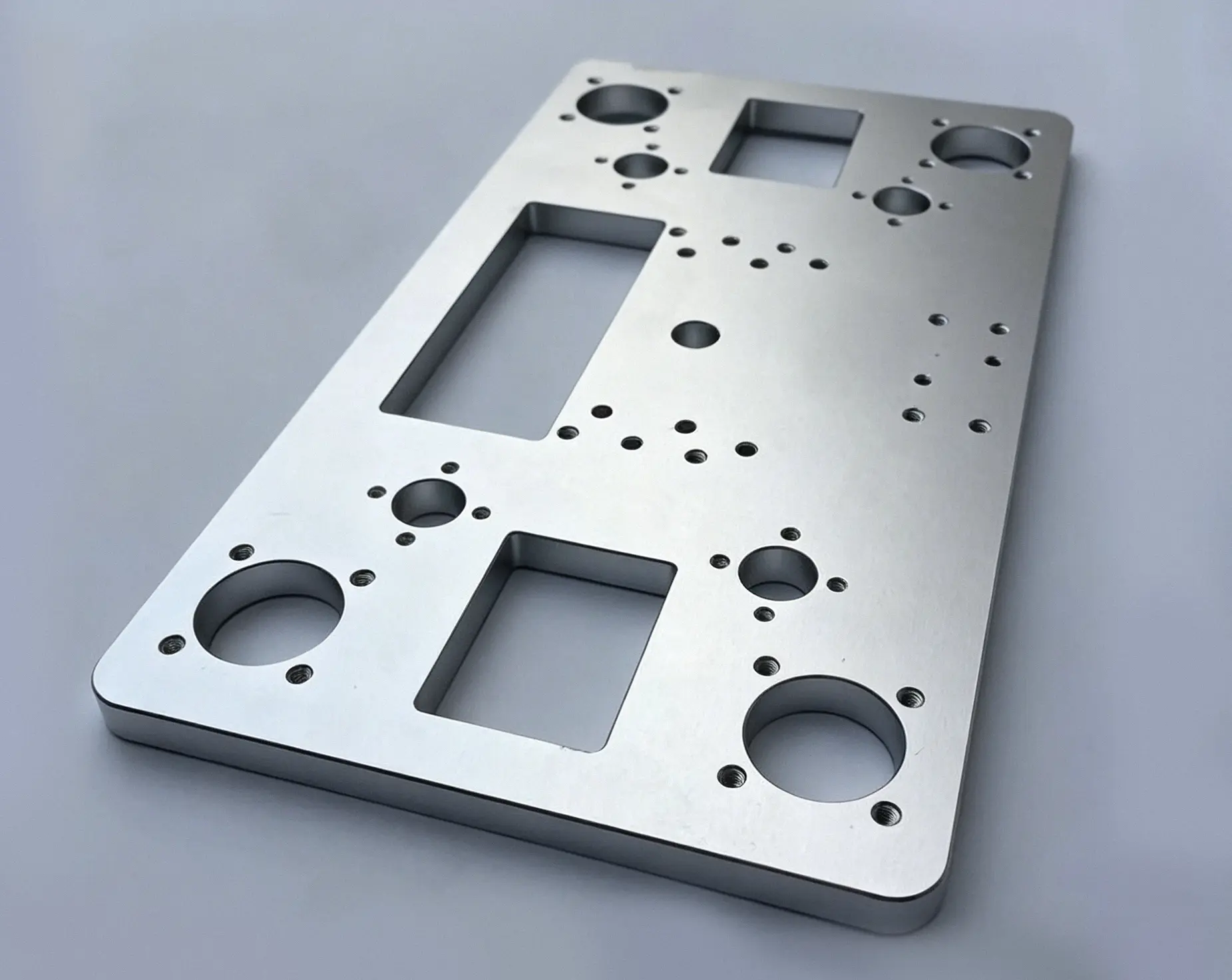CNC-milled brushed-aluminum base plate with custom holes