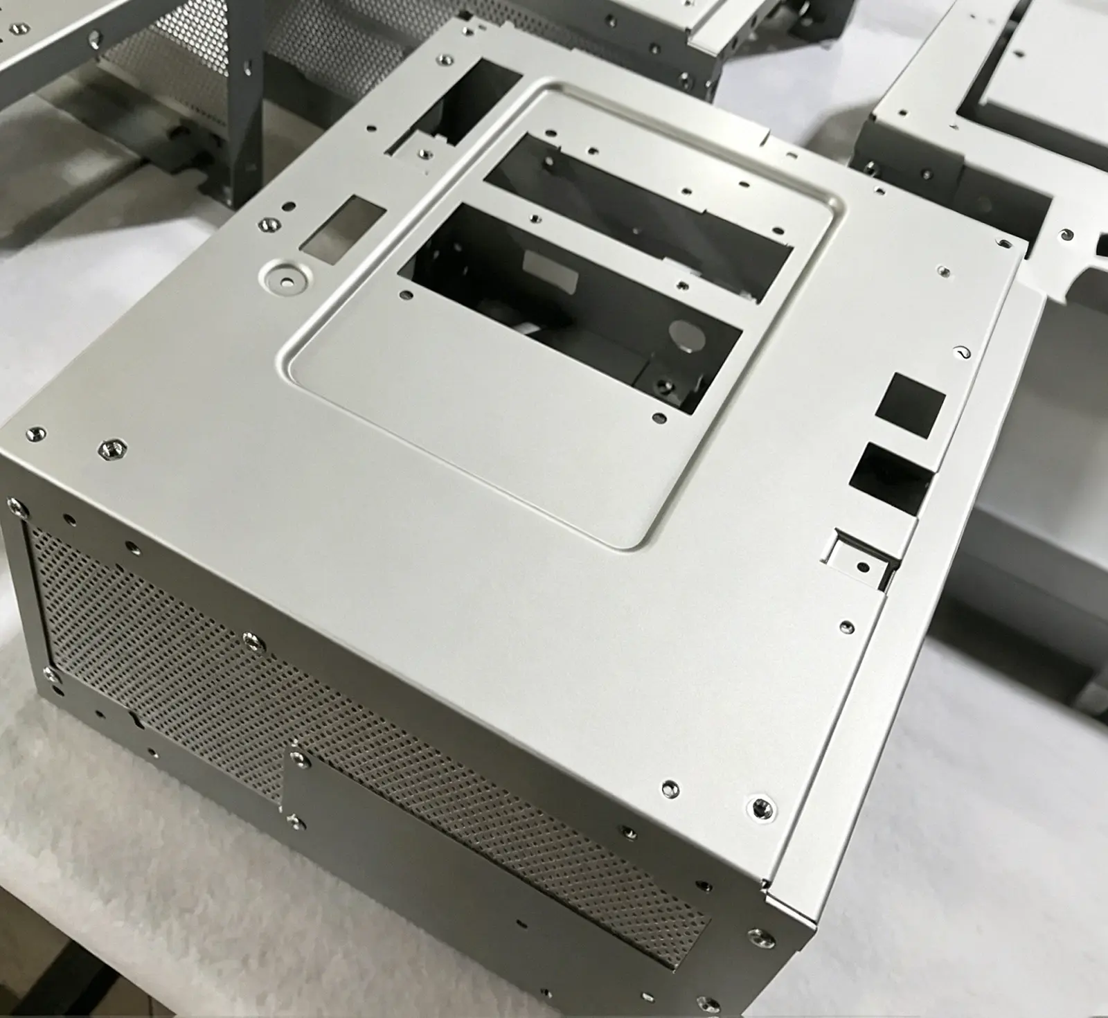 Laser-cut aluminum equipment enclosure with perforated panels