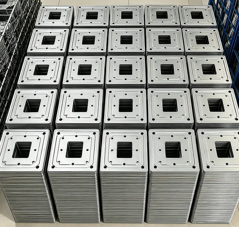 Mass-produced square stamped components with enclosure cutouts